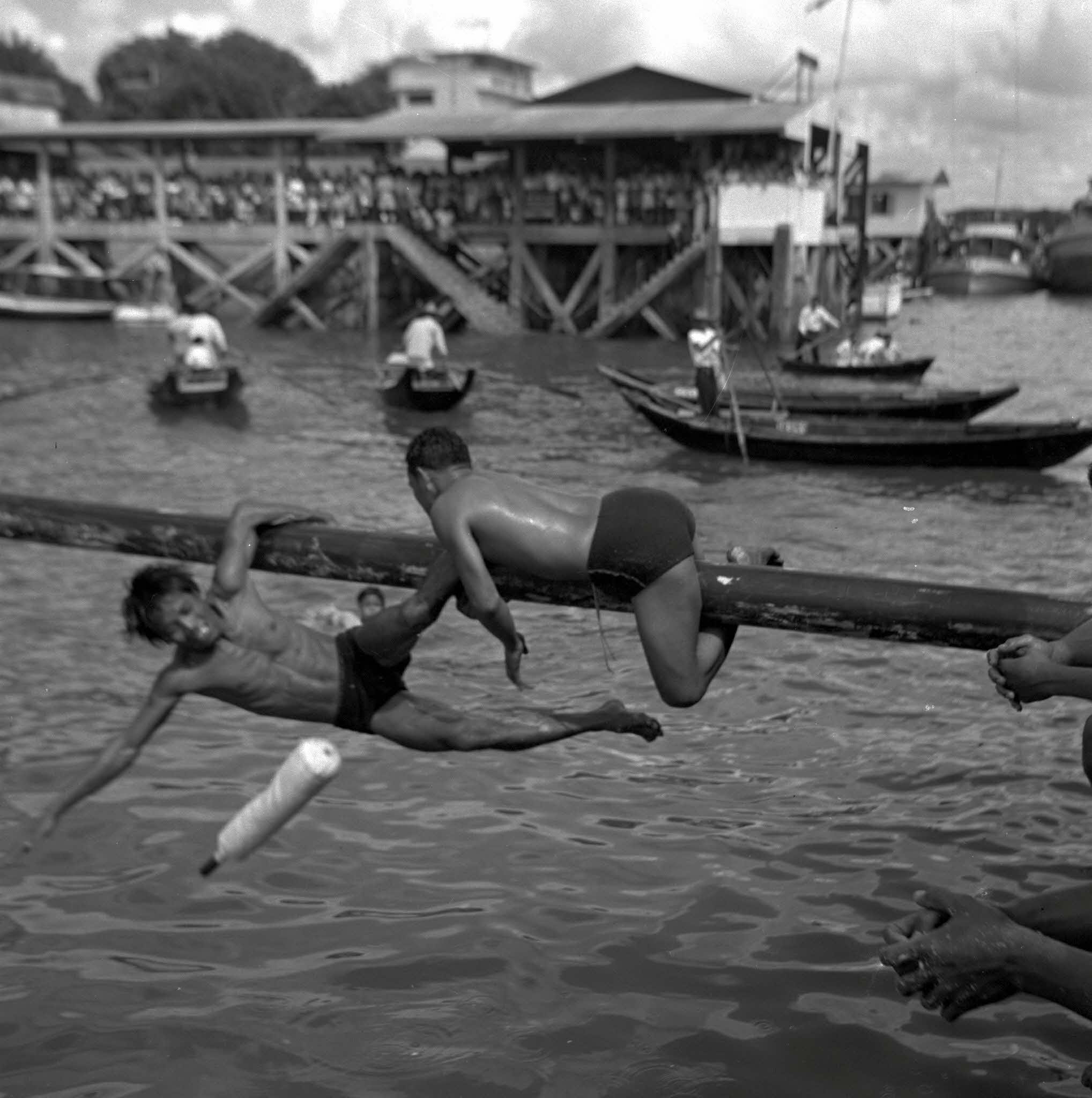 Participants on the greasy beam, 1954